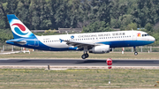 Chongqing Airlines Airbus A320-232 (B-9977) at  Beijing - Capital, China