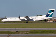 WestJet Encore Bombardier DHC-8-402Q (C-FIWE) at  Calgary - International, Canada