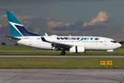 WestJet Boeing 737-7CT (C-GWCM) at  Calgary - International, Canada