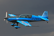 The Blades Extra EA-300L (G-ZXCL) at  Farnborough, United Kingdom